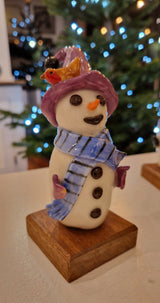 Handmade Large Ceramic Snowmen 2025 by Barbara Chadwick Purple bobble hat with robin and light blue stripped scarf Gift from Barewall Art Gallery