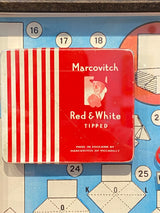 Vintage ‘Marcovitch Red and White Tipped’ tin framed with vintage book art. By Lost and Found Projects.