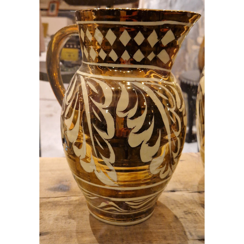 Large hand thrown jug decorated with copper lustre on lemon glaze signed Gordon Forsyth