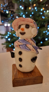 Handmade Large Ceramic Snowmen 2025 by Barbara Chadwick Pink and Blue scarf and cap with snow headphones Gift from Barewall Art Gallery