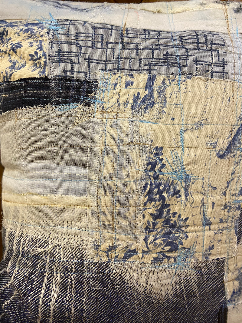Handmade reworked cushion in salvage linen, denim, fabrics and treads. By Lost and Found Projects and JMR Design