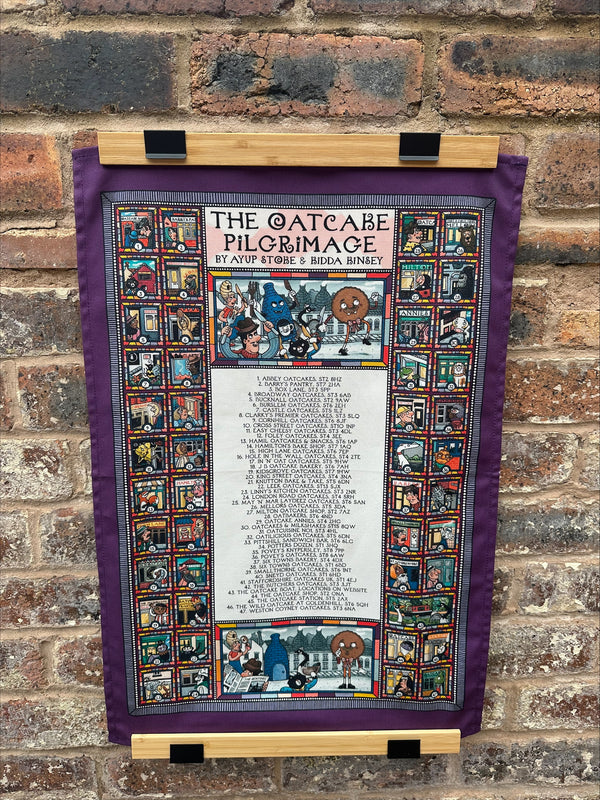 Ay Up Stoke X Kidda Kinsey Oatcake Pilgrimage tea towel 2025 Textiles from Barewall Art Gallery