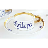 FLUX Type Matters range by Jim Williams for FLUX Stoke on Trent Espresso cup and saucer Gold Ceramics from Barewall Art Gallery