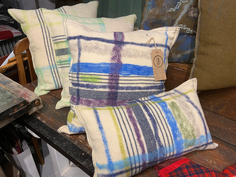 Handmade felted cushion with vintage blankets and handwork. Oblong blue and purple felt. By Lost and Found Projects and JMR Design by Barewall