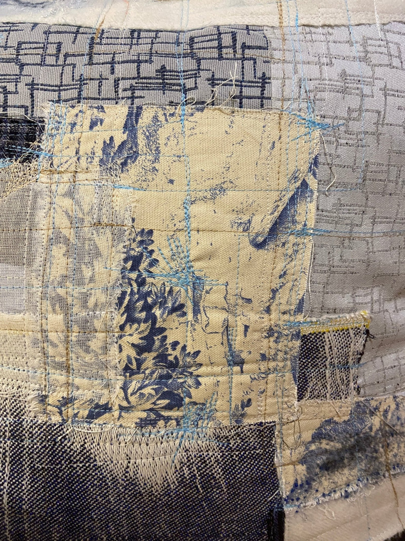 Handmade reworked cushion in salvage linen, denim, fabrics and treads. By Lost and Found Projects and JMR Design by Barewall