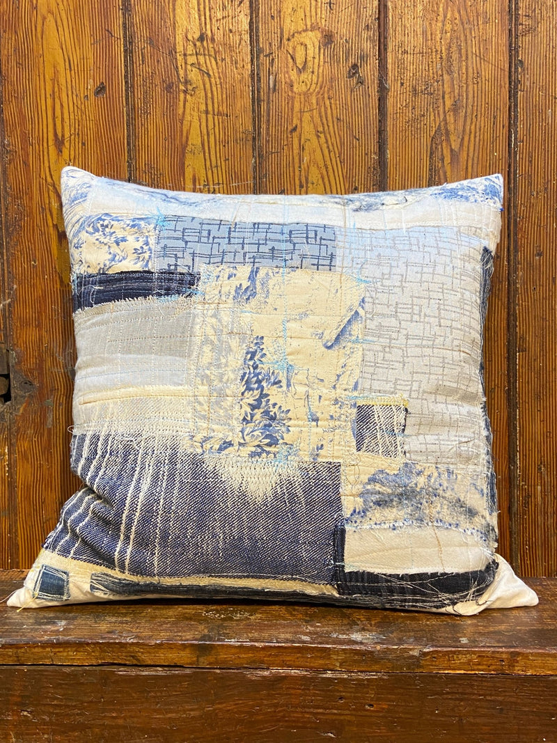 Handmade reworked cushion in salvage linen, denim, fabrics and treads. By Lost and Found Projects and JMR Design by Barewall