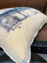 Handmade reworked oblong cushion in vintage blanket and salvage treads (blue). By Lost and Found Projects and JMR Design by Barewall