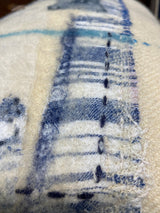 Handmade reworked oblong cushion in vintage blanket and salvage treads (blue). By Lost and Found Projects and JMR Design by Barewall