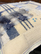 Handmade reworked square cushion in vintage blanket and salvage treads (blue). By Lost and Found Projects and JMR Design by Barewall