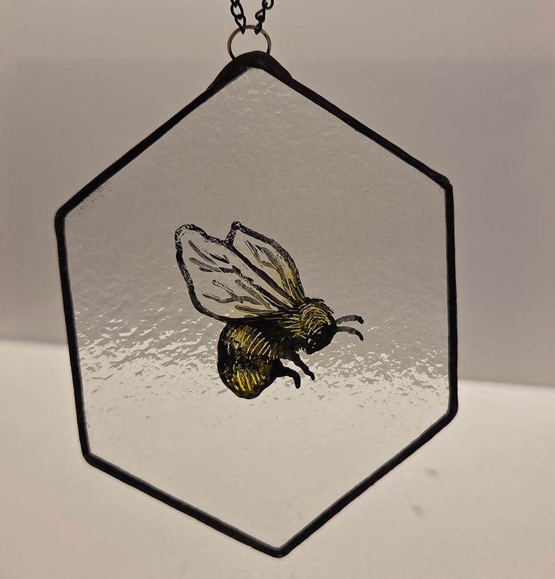 Reclaimed Stained Glass Hexagonal with painted bee 2025 by Rebecca Davies Bee on hexagonal reclaimed vintage leaded white glass Glass from Barewall Art Gallery