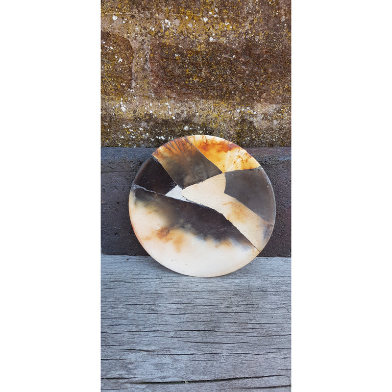Round reconstructed plates by June Ridgway