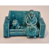 May n Mar Lady Figures in Armchair 2022 av Ian Tinsley Pottery