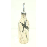 Grasping the Orient Oil Pourer by Michelle Freemantle