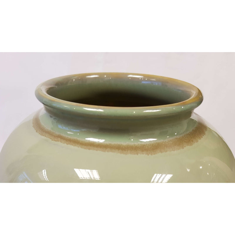Large hand thrown vase decorated in light green glaze by Anne Potts for Bullers